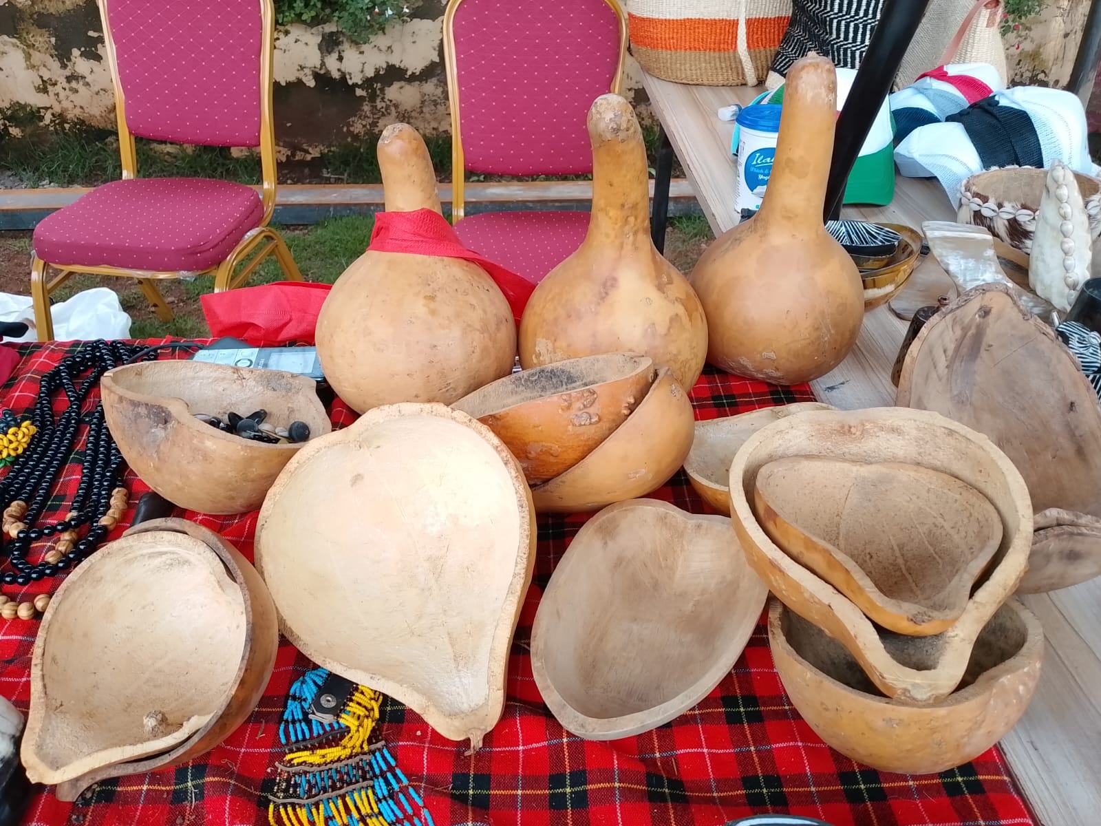 Traditional Agĩkũyũ calabash gourds (mĩbũthũ) displayed on a patterned cloth